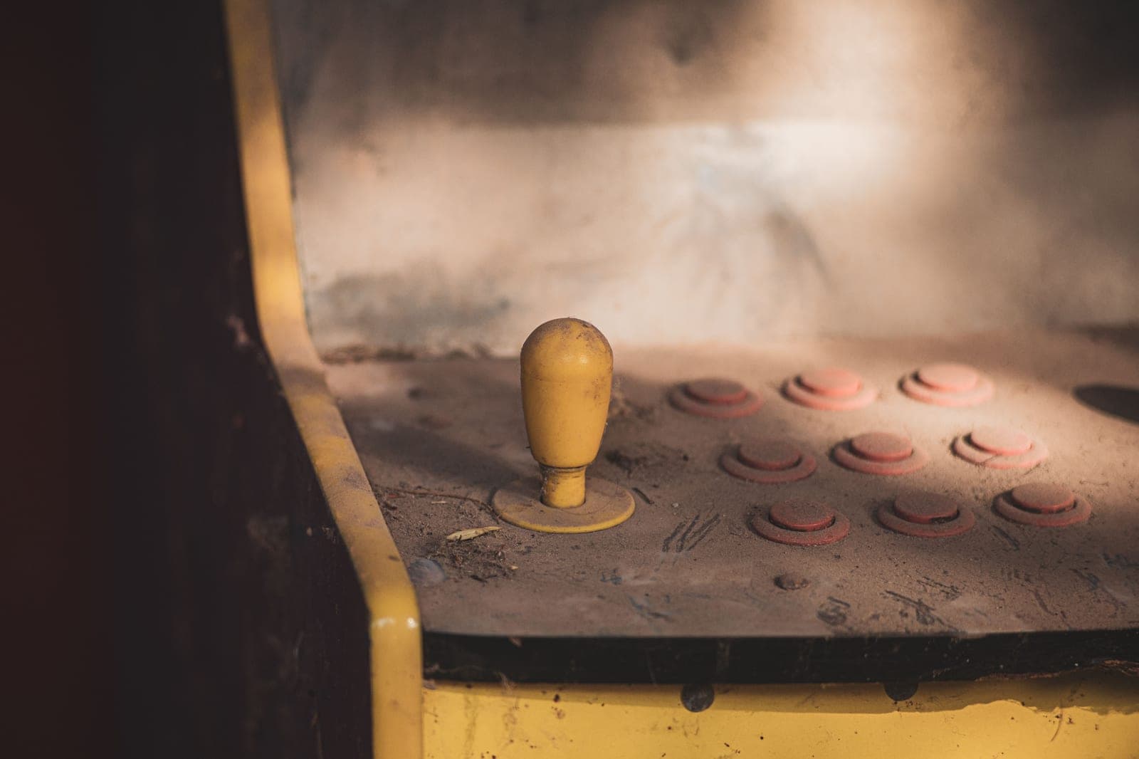 An arcade cabinet control panel with a joystick and buttons