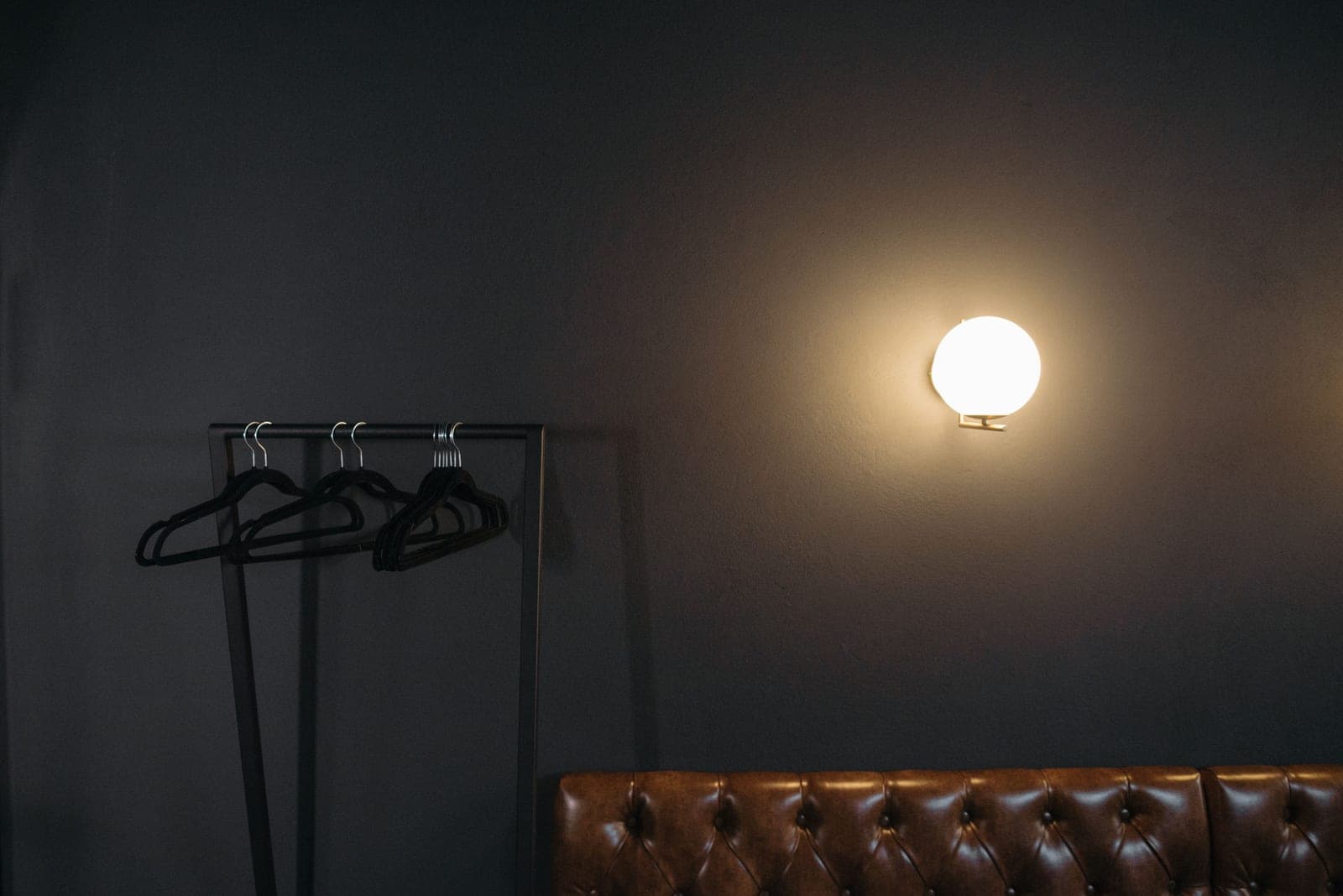 A dark sofa in a basement den