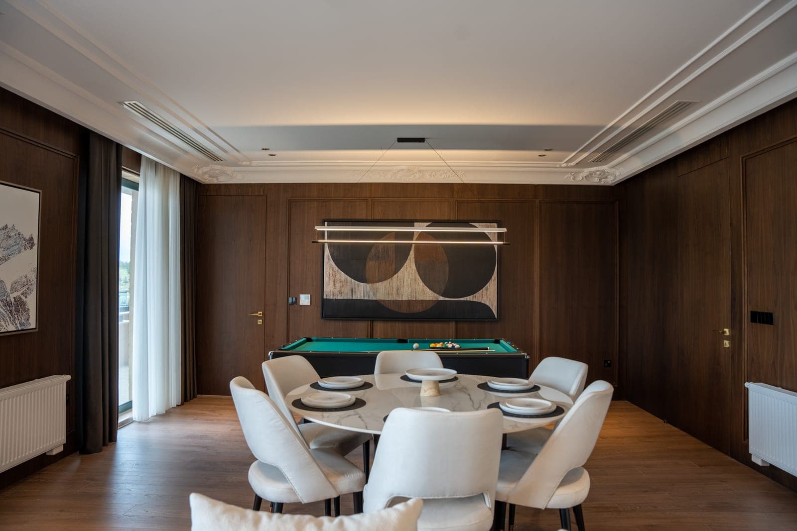 A furniture-finish pool table with a solid dining top fitted over the playfield