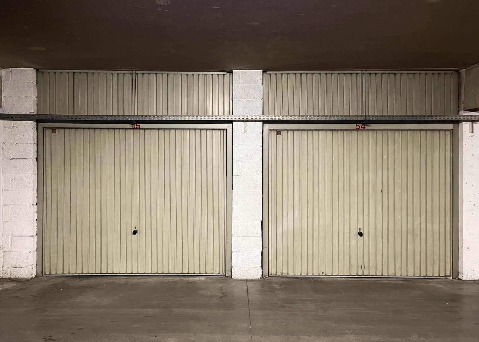 The inside of a single-car garage looking toward the closed door